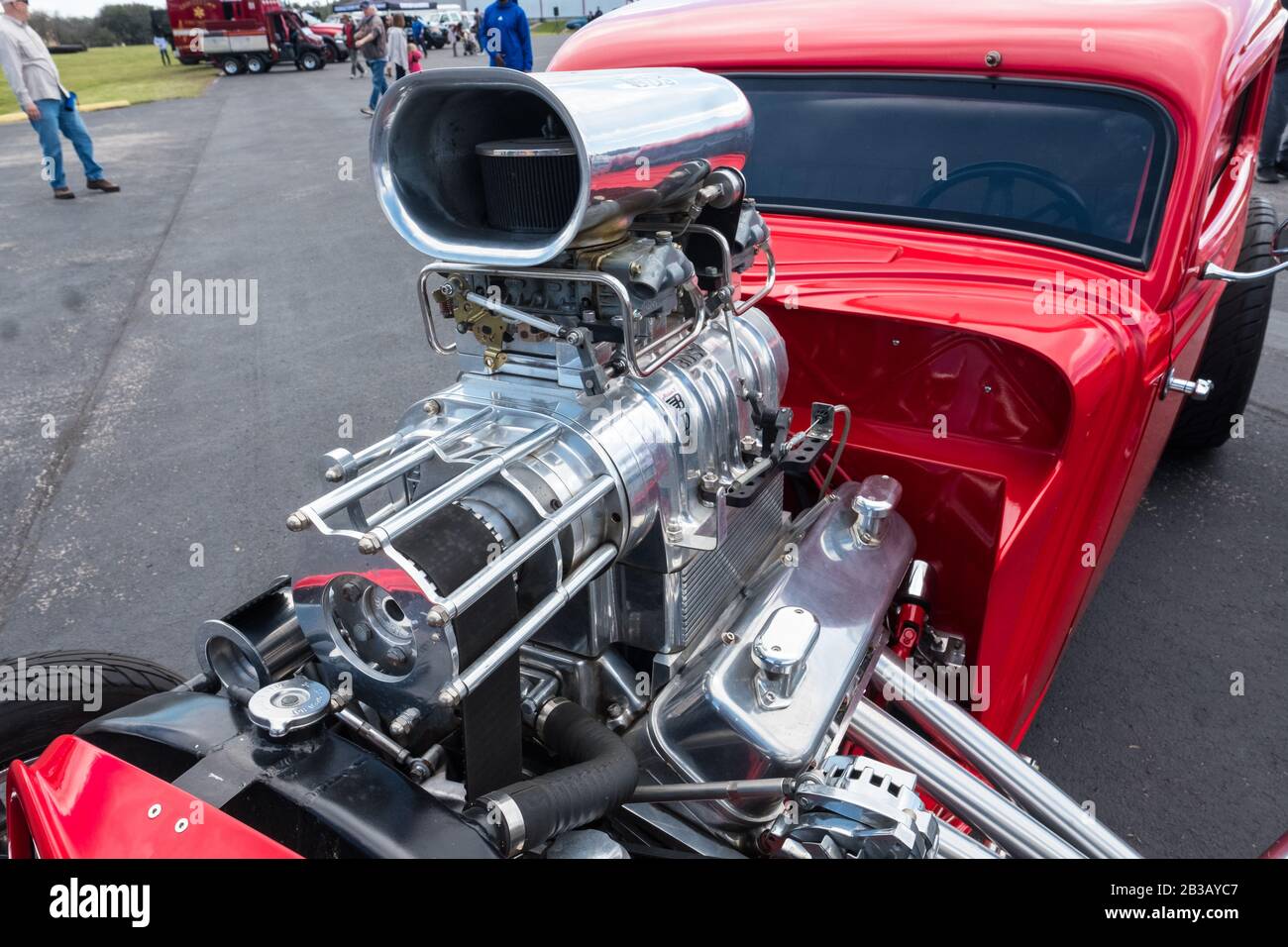 Supercharged V8 engine of bright red hot rod Stock Photo Alamy