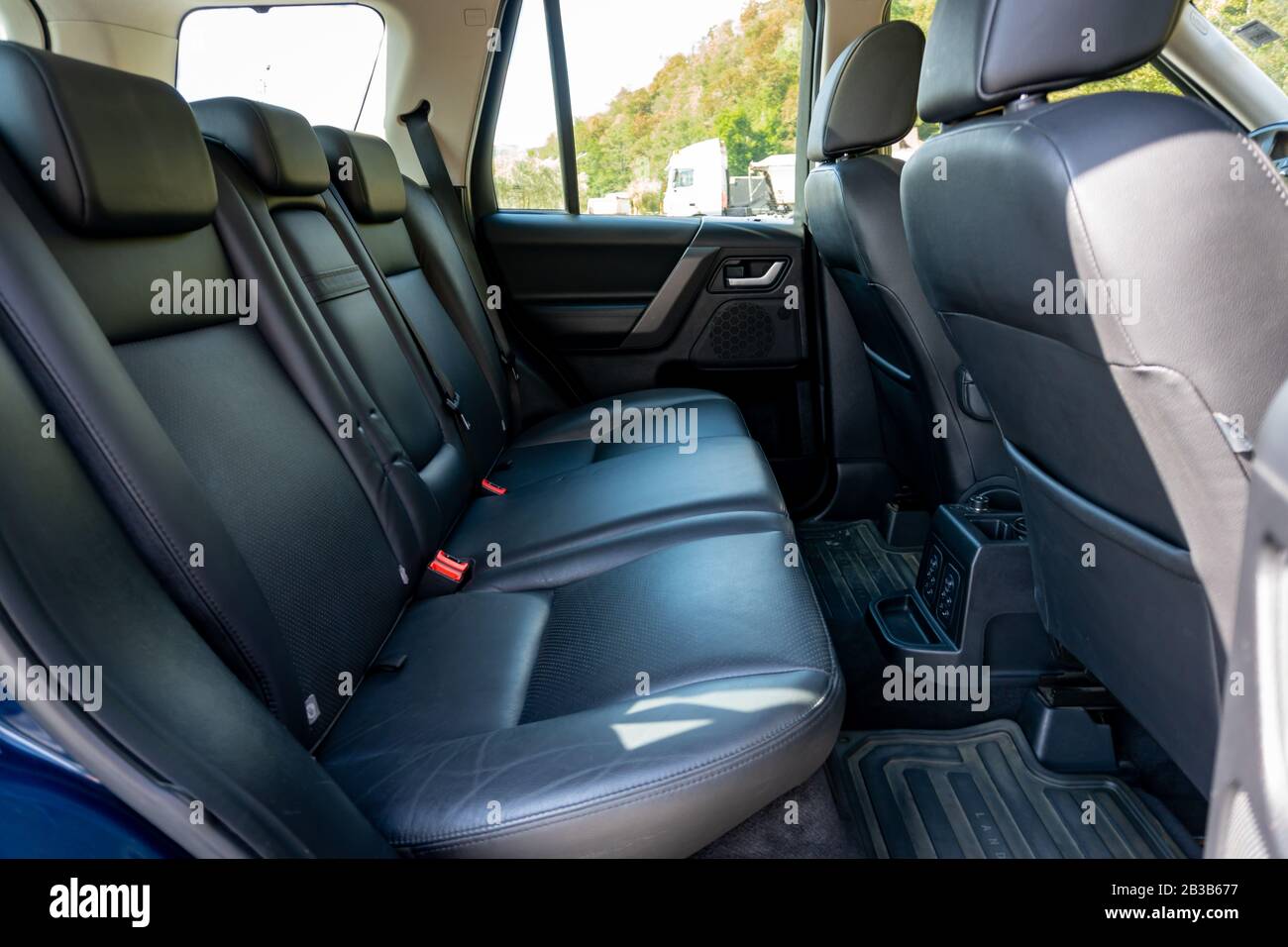 Panoramic roof - double sunroof in a luxurious suv car, glazed dach glass, blue tinted windows, and leather upholstery. Inside a luxurious SUV Stock Photo