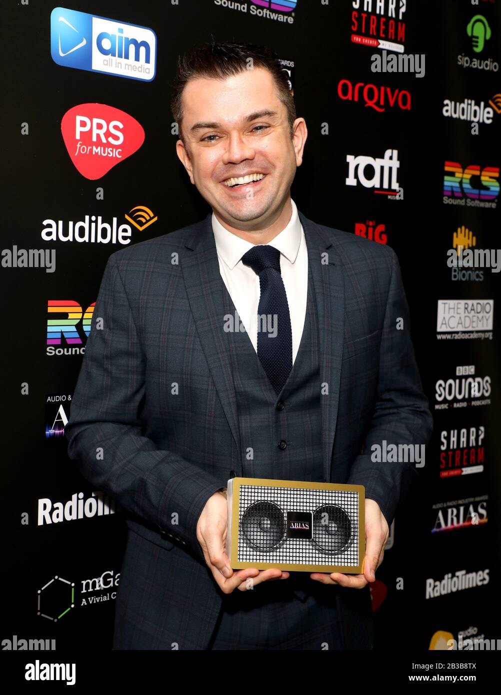Paul Sylvester with the Best Coverage of an Event award for Mental Health Awareness Week on Absolute Radio in the awards room during The Audio and Radio Industry Awards held at The London Palladium, London. Stock Photo