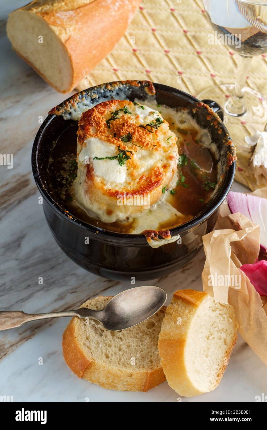 French onion soup with crispy gruyere cheese over toast Stock Photo - Alamy