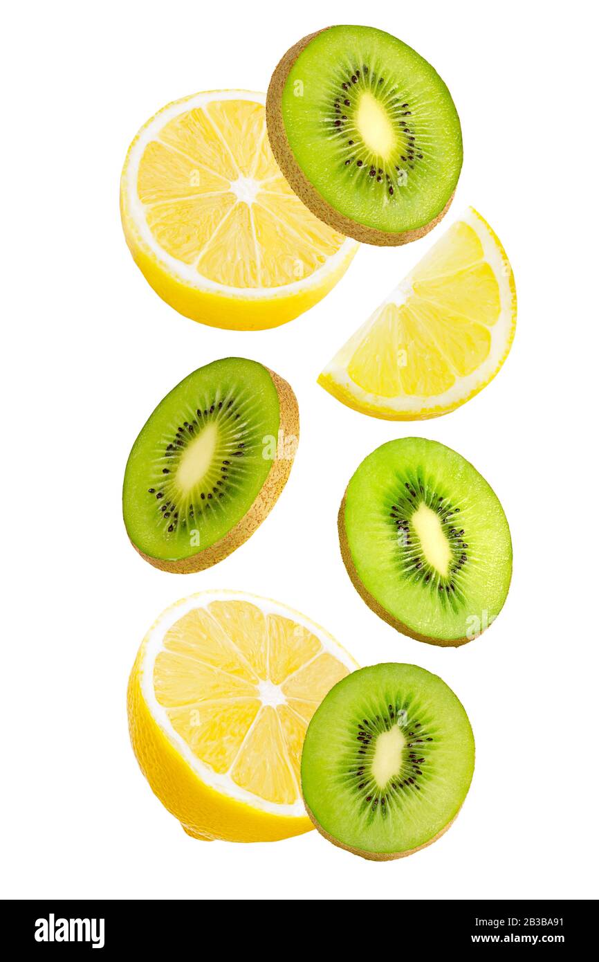 Falling kiwi and lemon isolated on white background. Stock Photo
