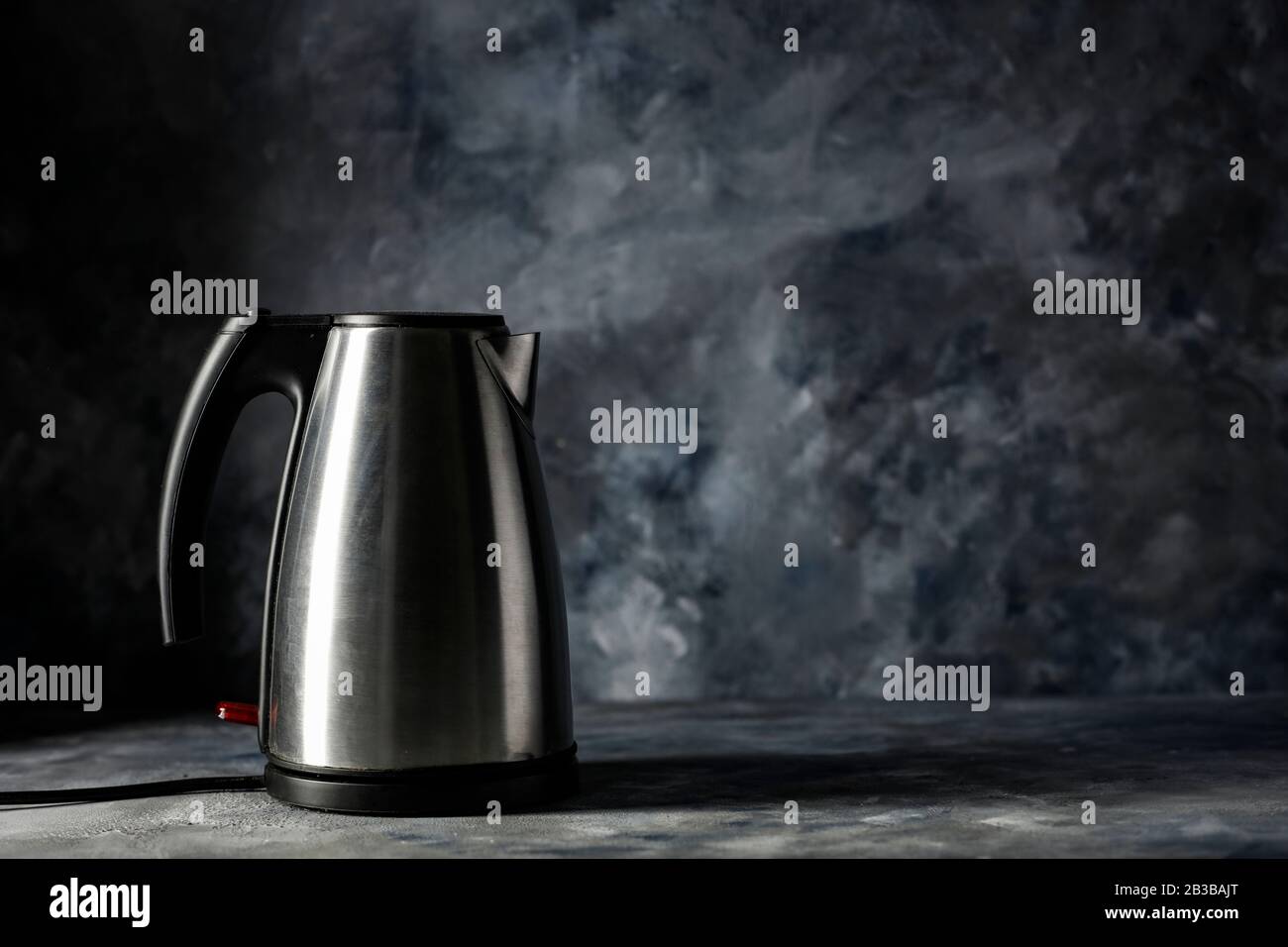 https://c8.alamy.com/comp/2B3BAJT/electric-kettle-and-dark-mood-wall-background-copy-space-for-your-decoration-and-dark-shadows-on-wall-2B3BAJT.jpg