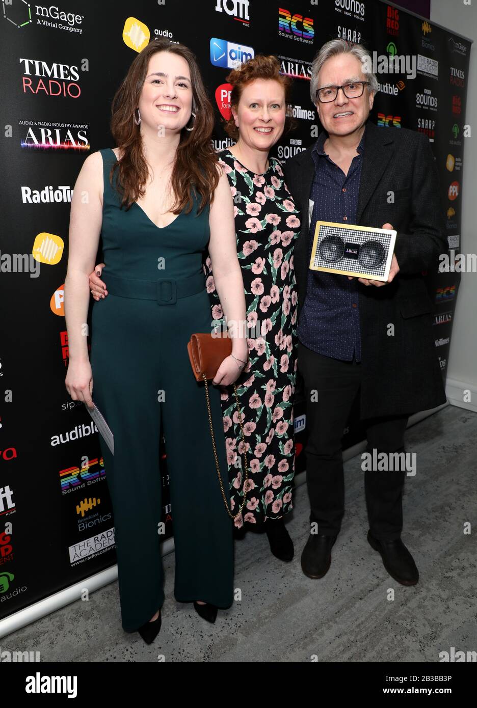 Emma Hearn, Eleanor Mein and John Scott Dryden with the Best Independent Podcast award for Passenger List by Goldhawk Productions and Radiotopia in the awards room during The Audio and Radio Industry Awards held at The London Palladium, London. Stock Photo