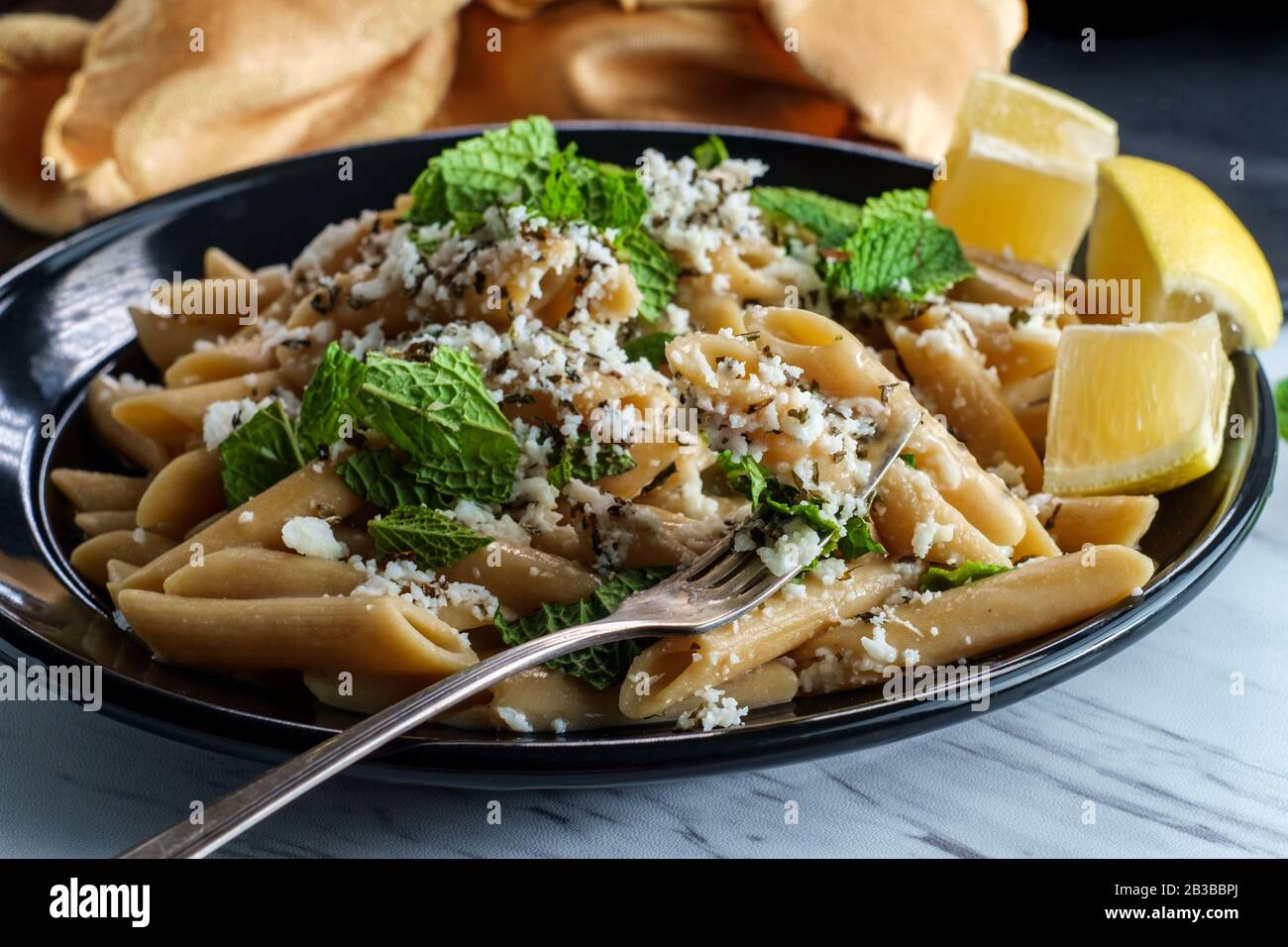 Greek halloumi cheese pasta with mint and lemon juice Stock Photo Alamy