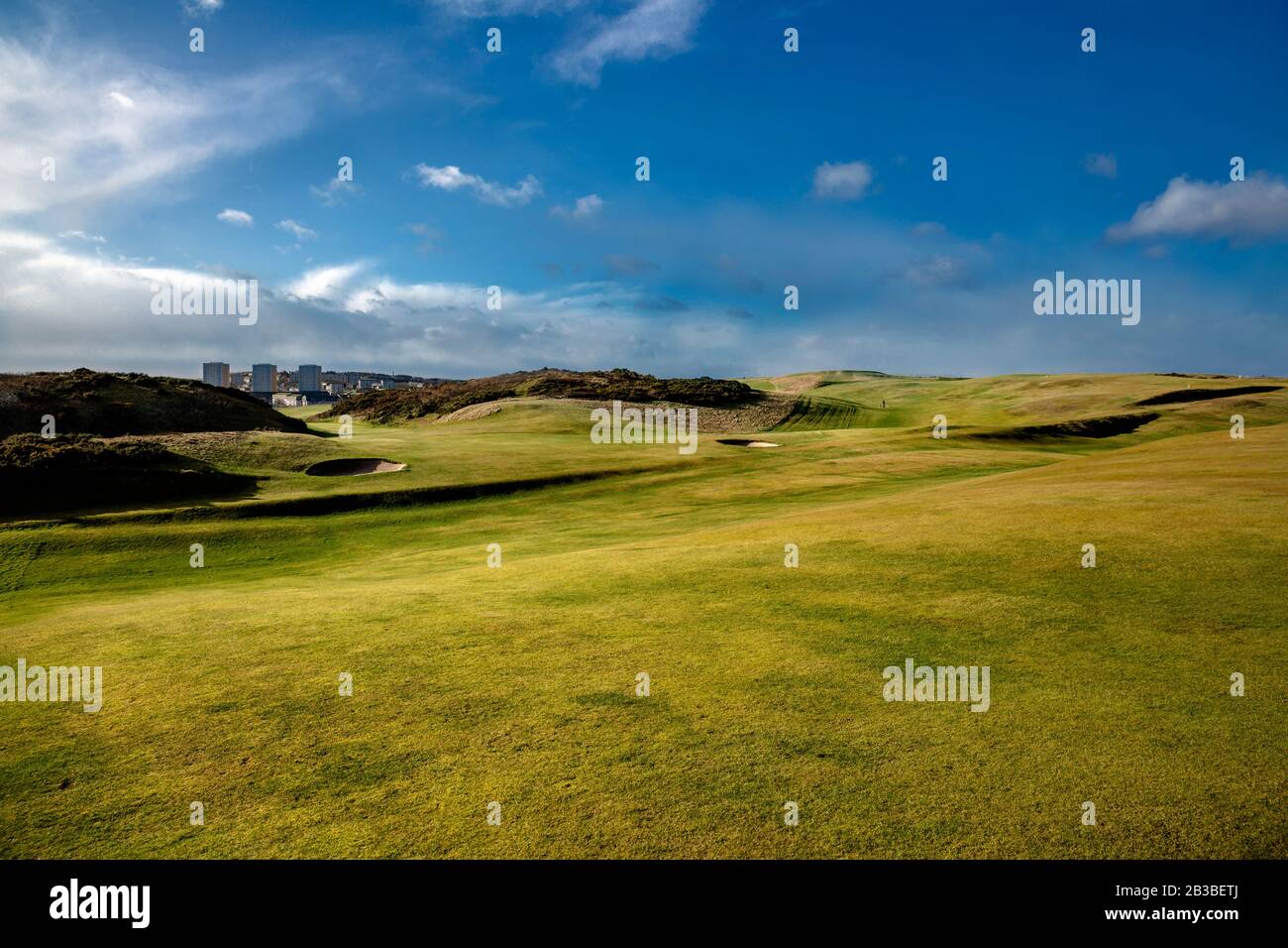 Landscape, Aberdeen Golf Club with clouds and grass field. Nigg Bay, Scotland. Stock Photo
