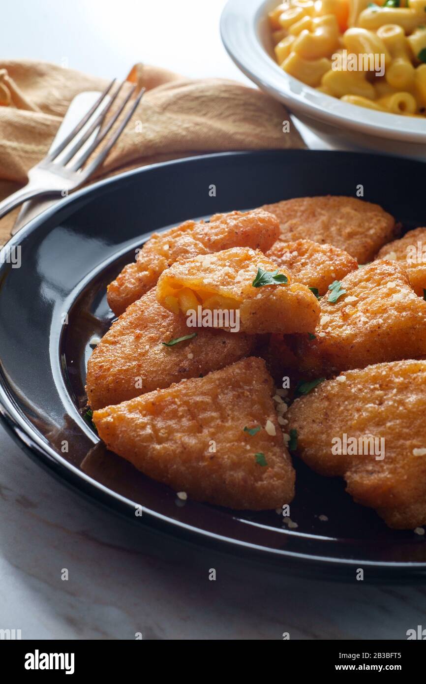 Battered And Deep Fried Macaroni And Cheese Wedges Appetizer Stock Photo Alamy