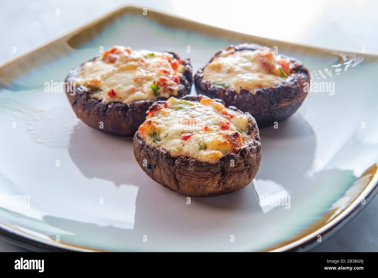Italian cremini mushrooms stuffed with fontina cheese and crumbled bacon Stock Photo Alamy