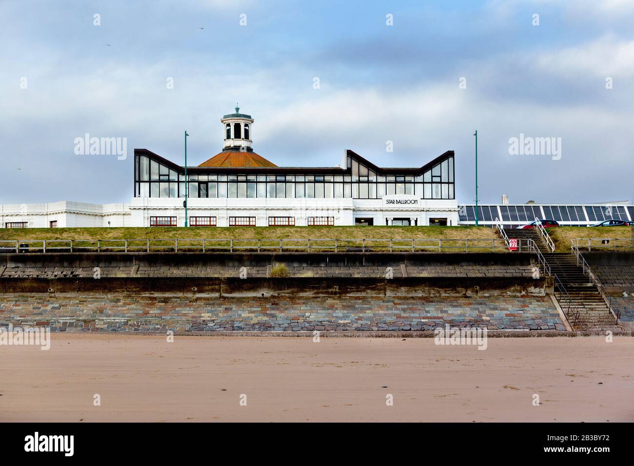 Rear view of the Beach Ballroom, art deco building on the seafront of Aberdeen, view from Aberdeen Beach, in Winter, with cloudy sky in background Stock Photo
