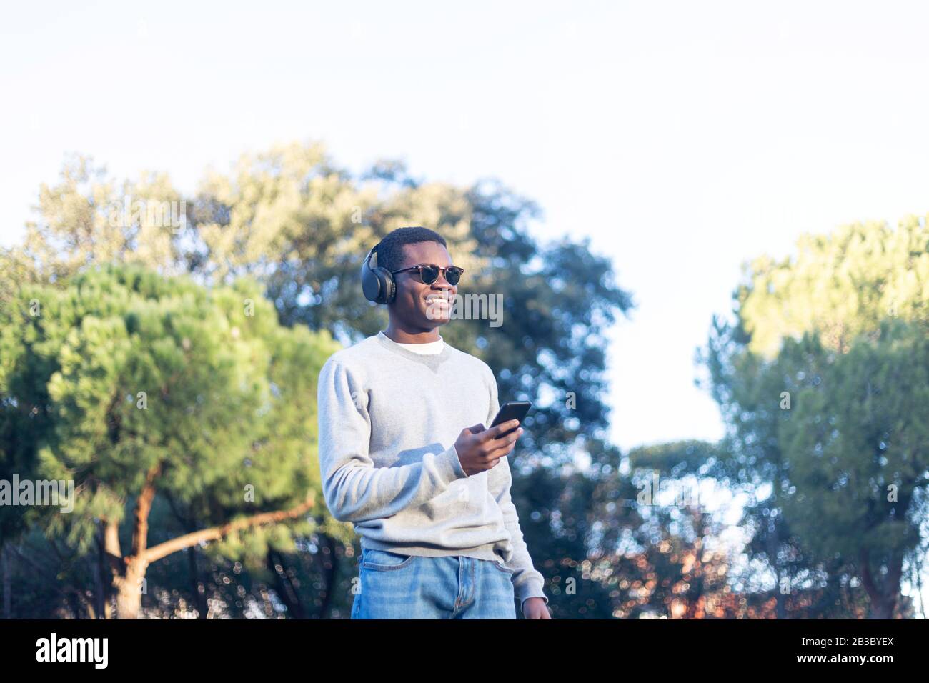 Afro man using mobile phone. Stock Photo