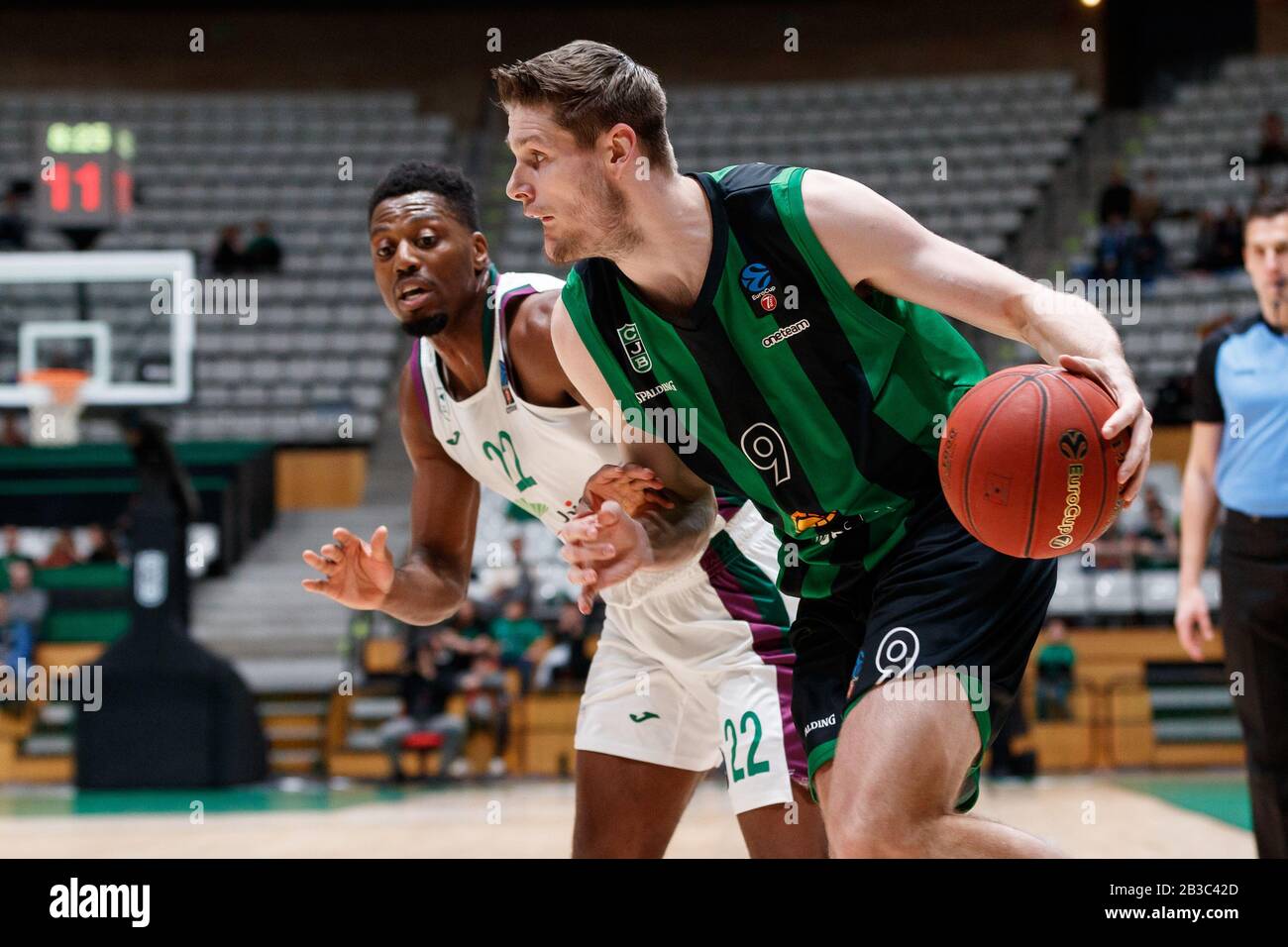 BADALONA, SPAIN - MARCH 04: Conor Morgan of Joventut Badalona In action  with Ruben Guerrero of Unicaja Malaga during the ULEB EuroCup basketball  second groups stage match, Group H played between Joventut