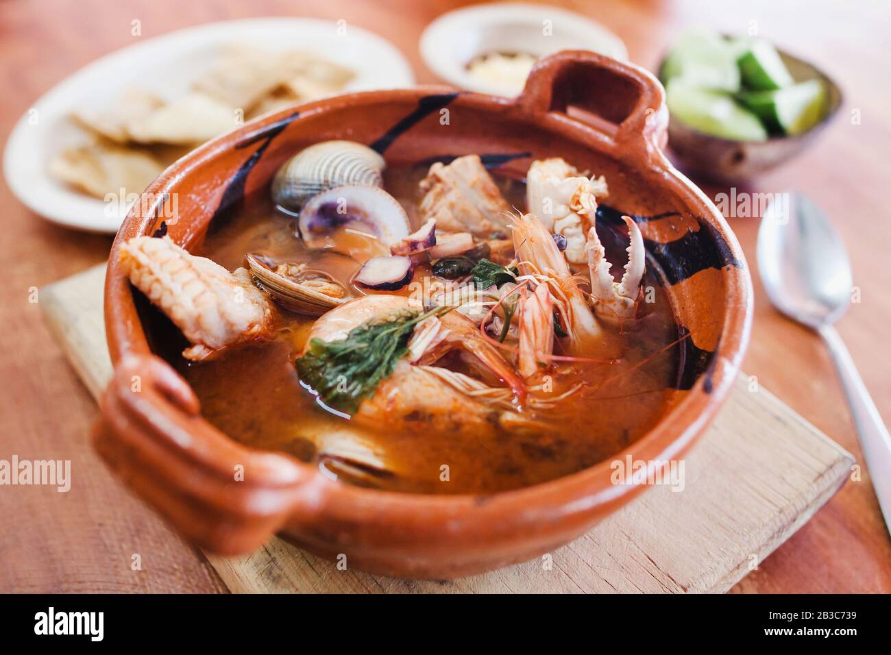 mexican seafood soup, cazuela de mariscos in Mexico is a bowl of spicy food with shrimps and fish Stock Photo