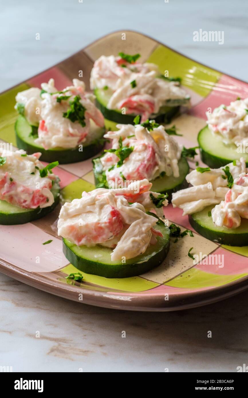 Glutenfree seafood salad with imitation crab meat served on cucumbers