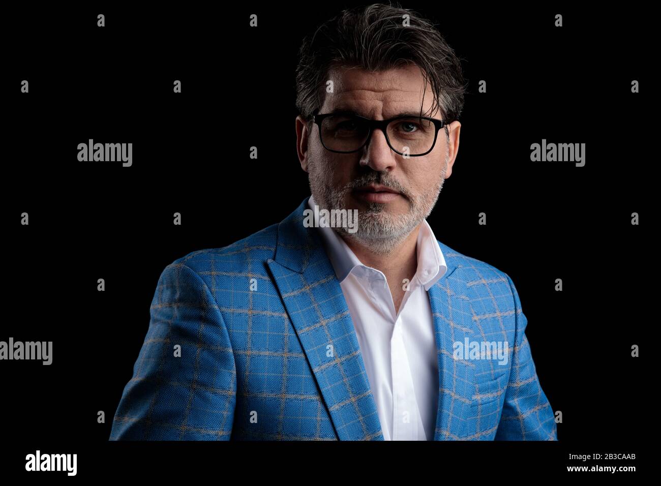 close up of a elegant formal business man wearing blue suit and glasses ...