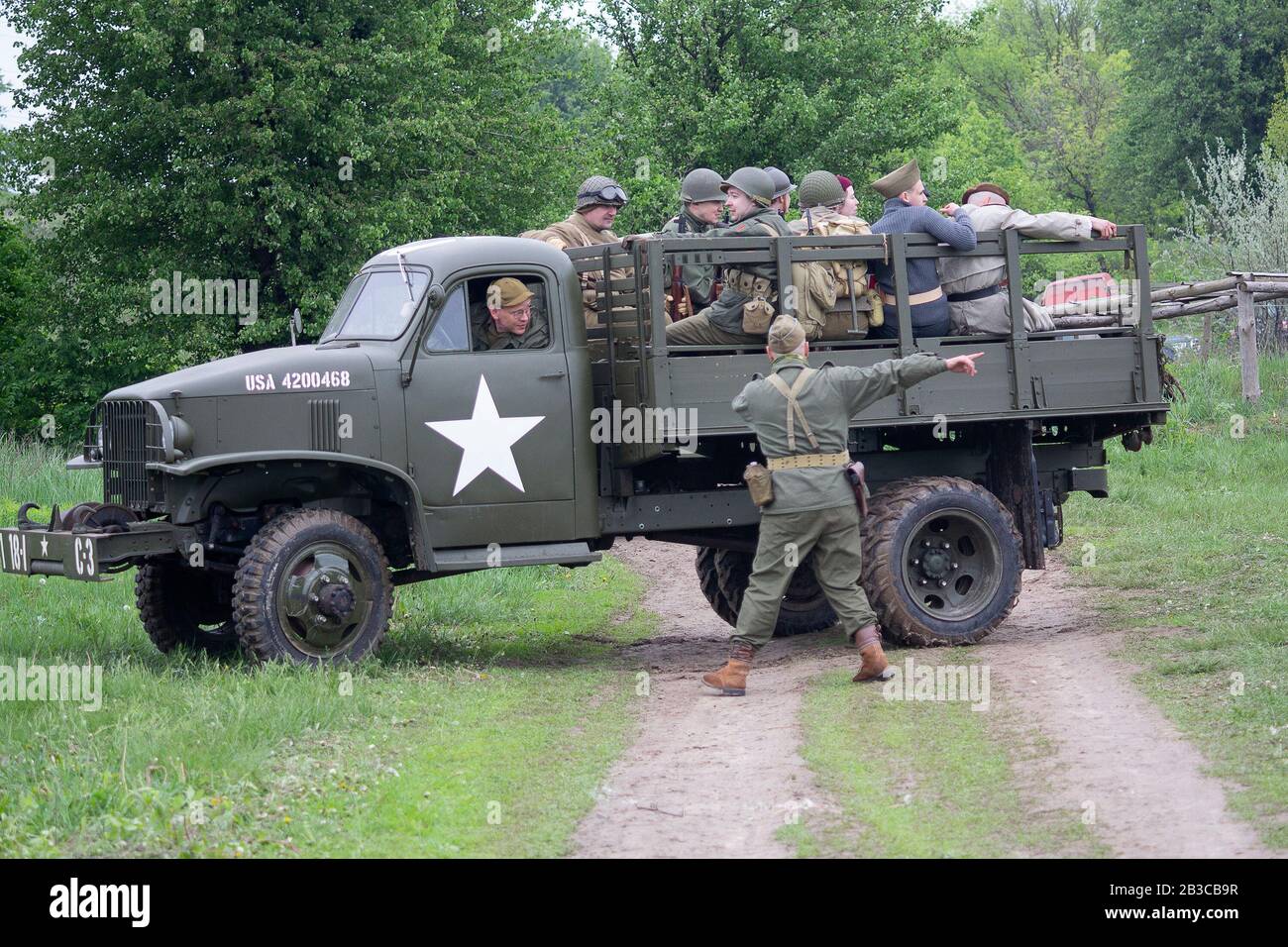 Kiev, Ukraine - May 9, 2019: Peoples in the form of US Army soldier of the Second World War on a truck on the historical reconstruction of the anniver Stock Photo