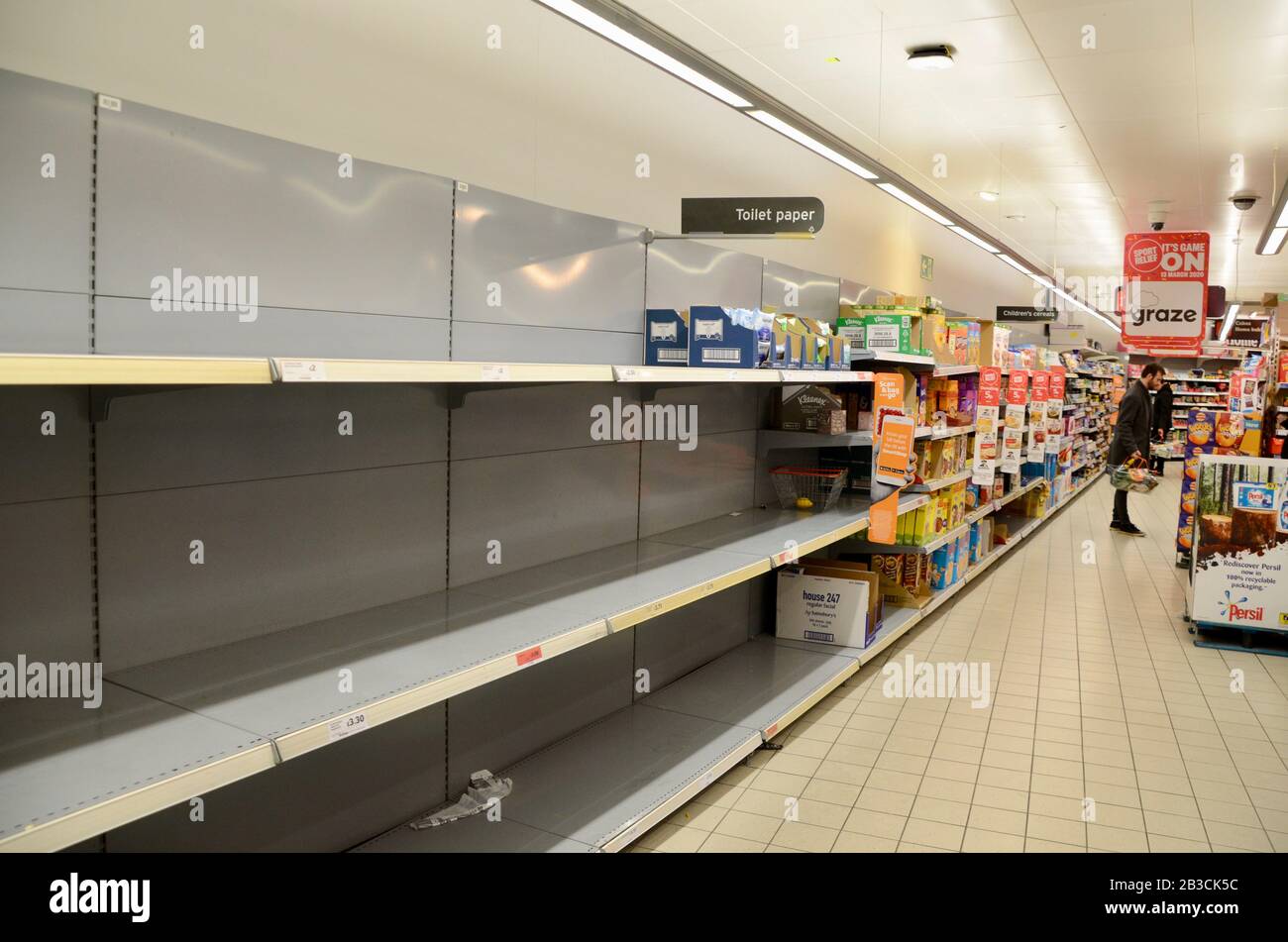empty toilet paper shelves in sainsbury store north london england UK