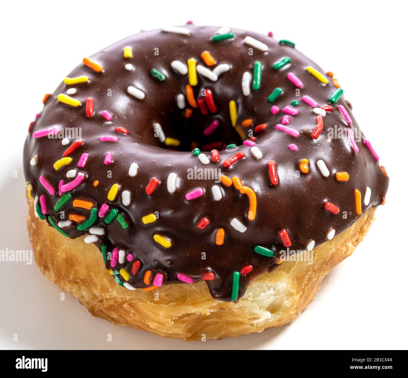 Chocolate glazed donut with sprinkles on a white background Stock Photo
