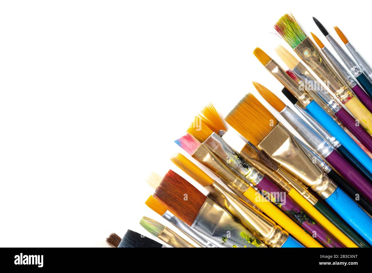 A collection of artists paint brushes on a white background Stock Photo