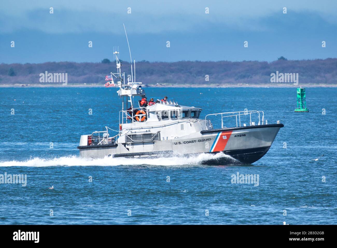SEPTEMBER 11, 2015, WESTPORT, WA: A U.S. Coast Guard Motor Life Boat speeds across Grays Harbor on its way the Coast Guard Station at Westport. If cap Stock Photo