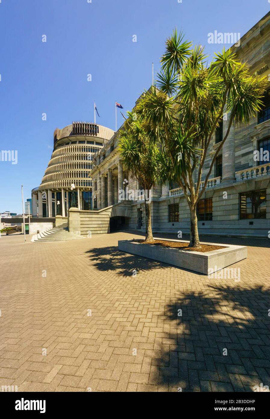 Parliament buildings located in Wellington, New Zealand. The Executive Wing is a distinctive shape and is commonly referred to as The Beehive. Stock Photo