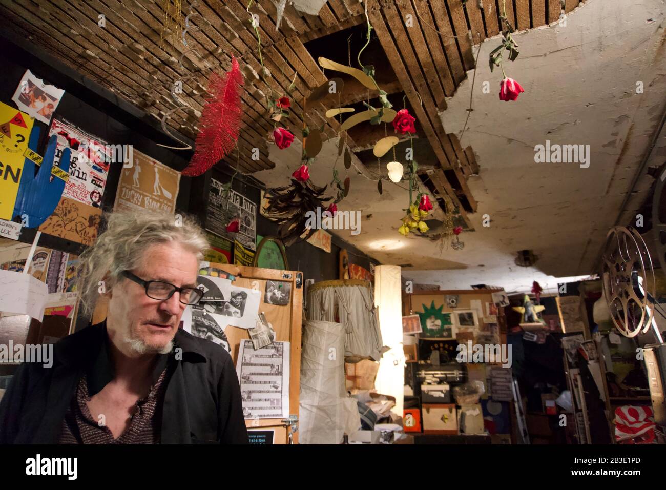 Experimental filmmaker Craig Baldwin in his basement film archive and