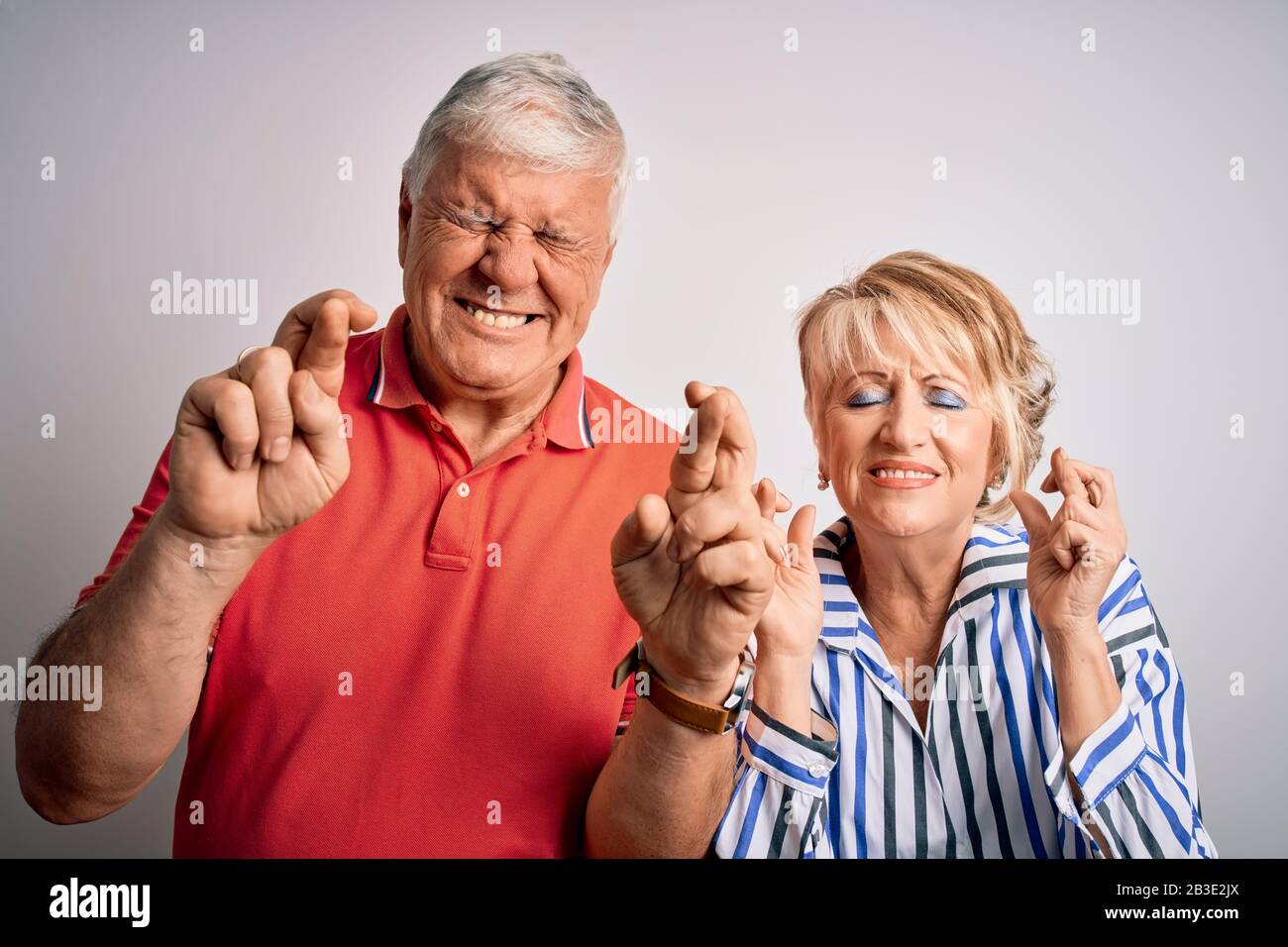 Senior beautiful couple standing together over isolated white ...