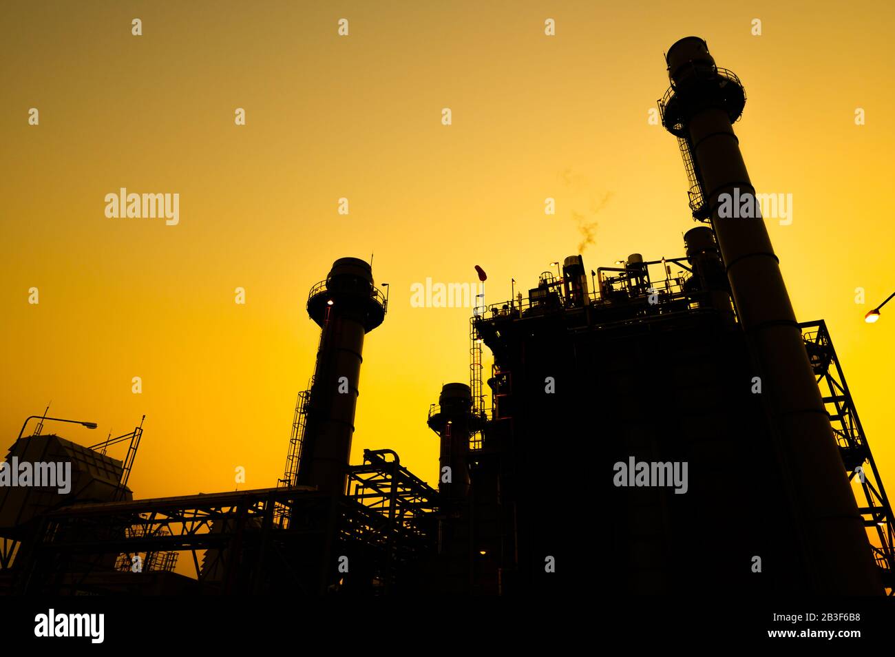 Petrochemical plant in silhouette image at sunset Stock Photo - Alamy