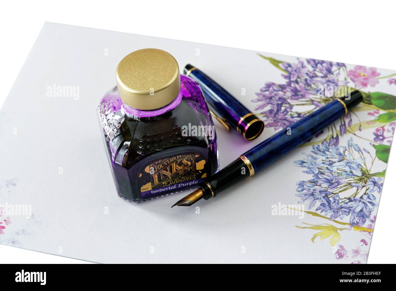 Fountain pen and a bottle of ink Stock Photo