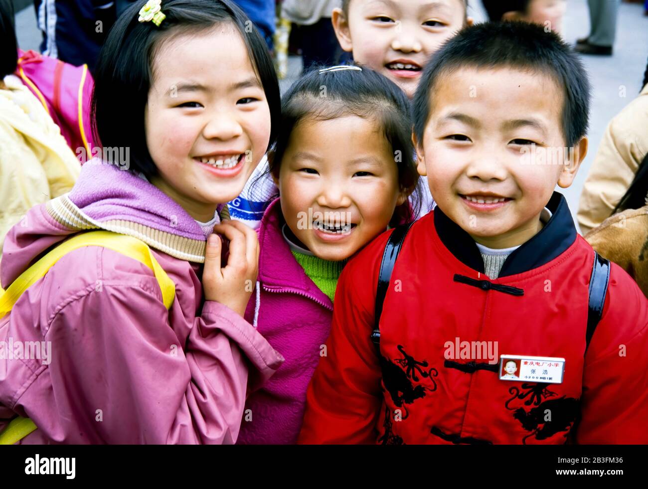Chongqing China , March 2005 - Young Chinese students posing for a group photo at a school outing in Chongqing,China. Stock Photo