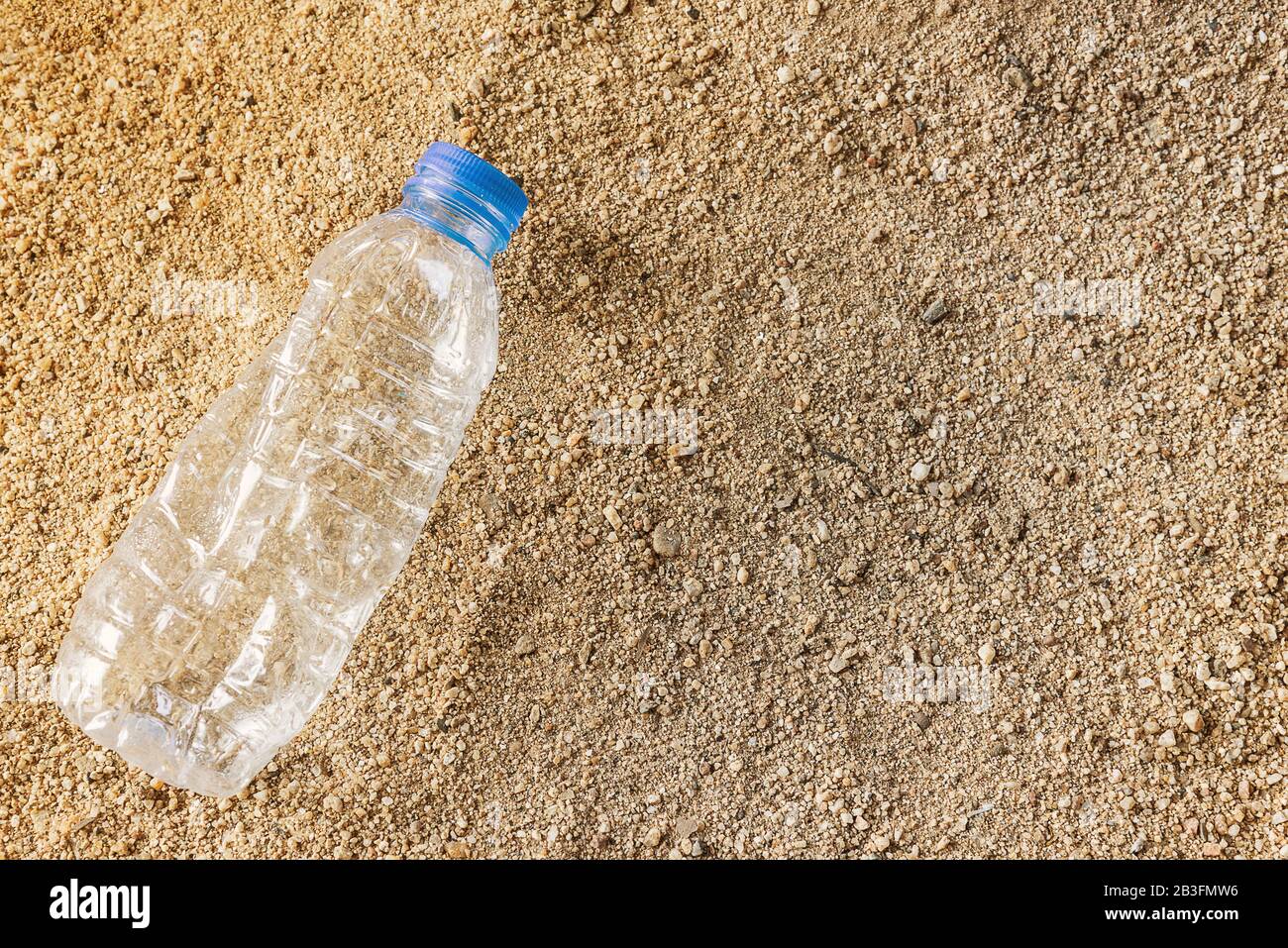 Plastic water bottles pollution in beach. Environment concept Stock