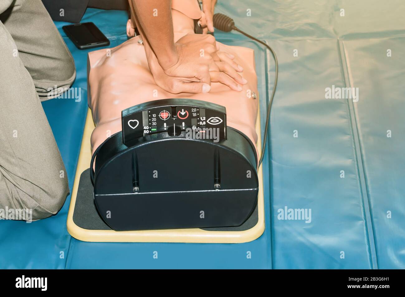 CPR aid dummy medical training with hand press Heart on doll emergency