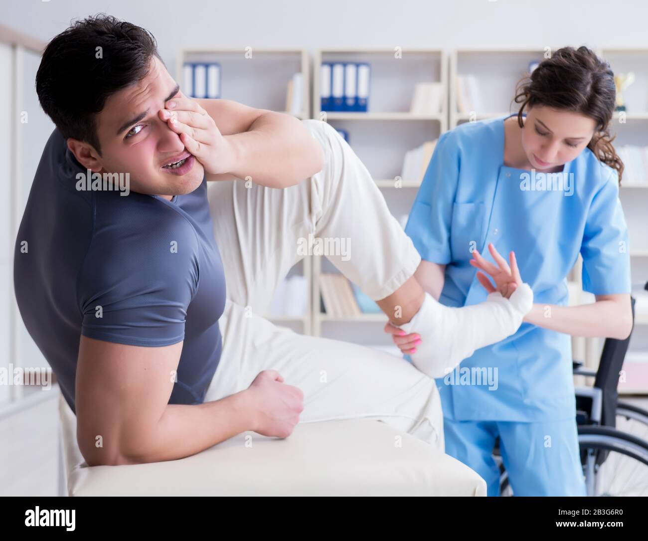 The doctor and patient during check-up for injury in hospital Stock Photo