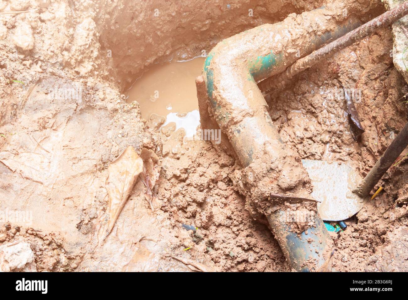 broken pipe in hole with water motion at roadside wait repair Stock Photo Alamy