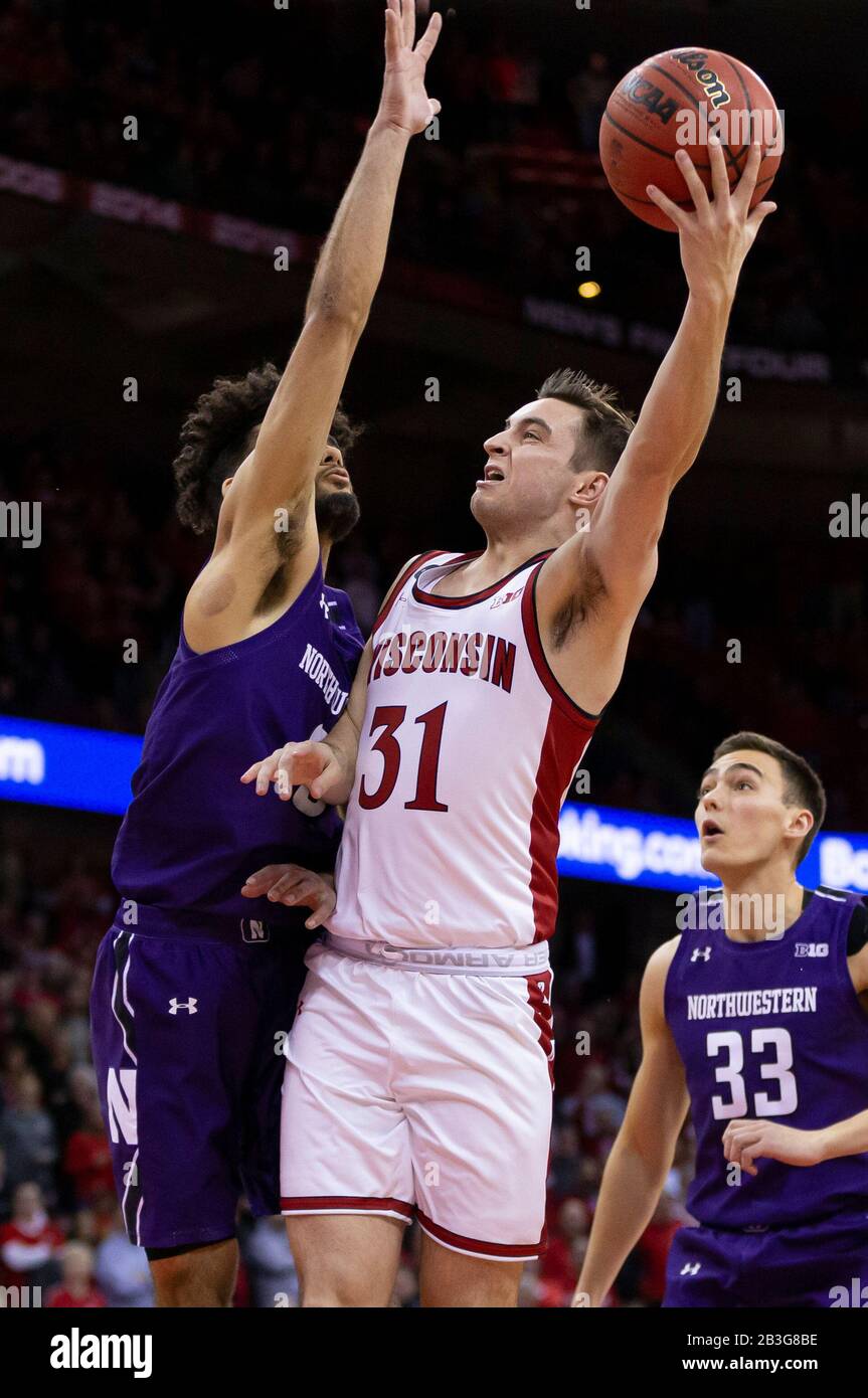 Madison, WI, USA. 4th Mar, 2020. On senior night Wisconsin Badgers guard Michael Ballard #31 scores in the final seconds of the NCAA Basketball game between the Northwestern Wildcats and the Wisconsin Badgers at the Kohl Center in Madison, WI. John Fisher/CSM/Alamy Live News Stock Photo
