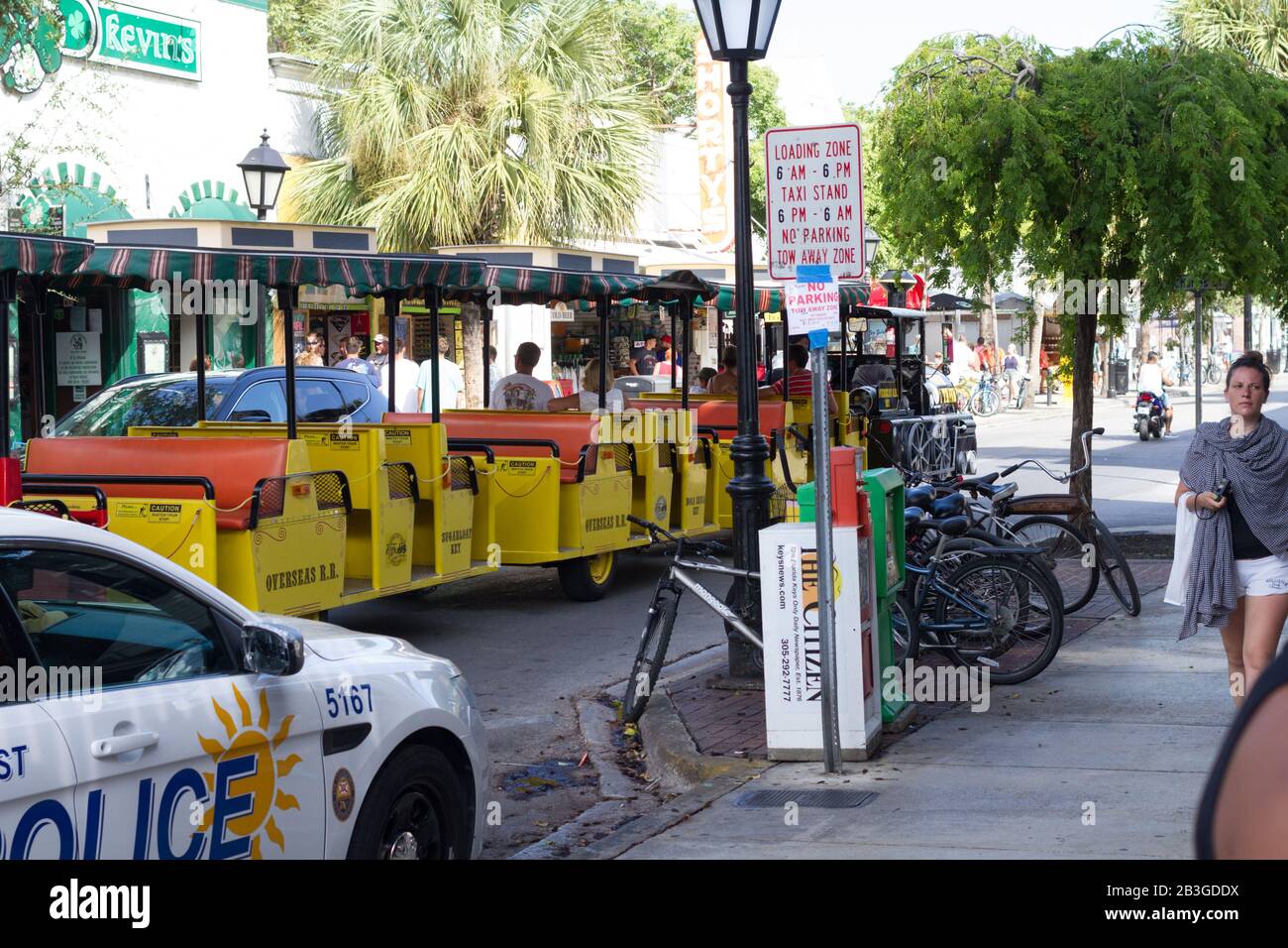 KEY WEST-AUGUST 6, 2015: A tourist tram rolls through downtown Key West, Florida. Stock Photo