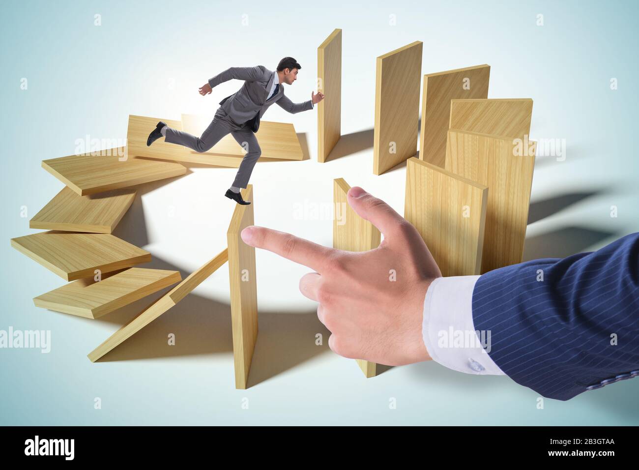 Domino effect and the competition concept Stock Photo - Alamy