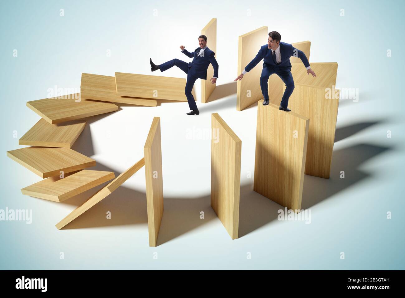 Domino effect and the competition concept Stock Photo - Alamy