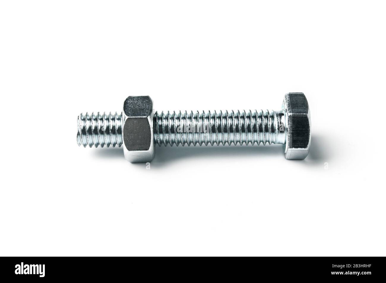 Bolt with nut isolated on white Stock Photo