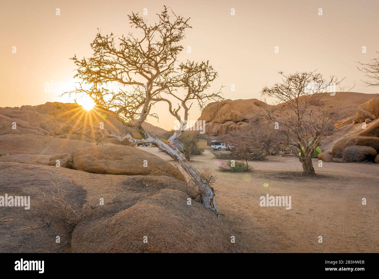 Camping life at sunrise in the Spitzkoppe National Park in Namibia. Stock Photo