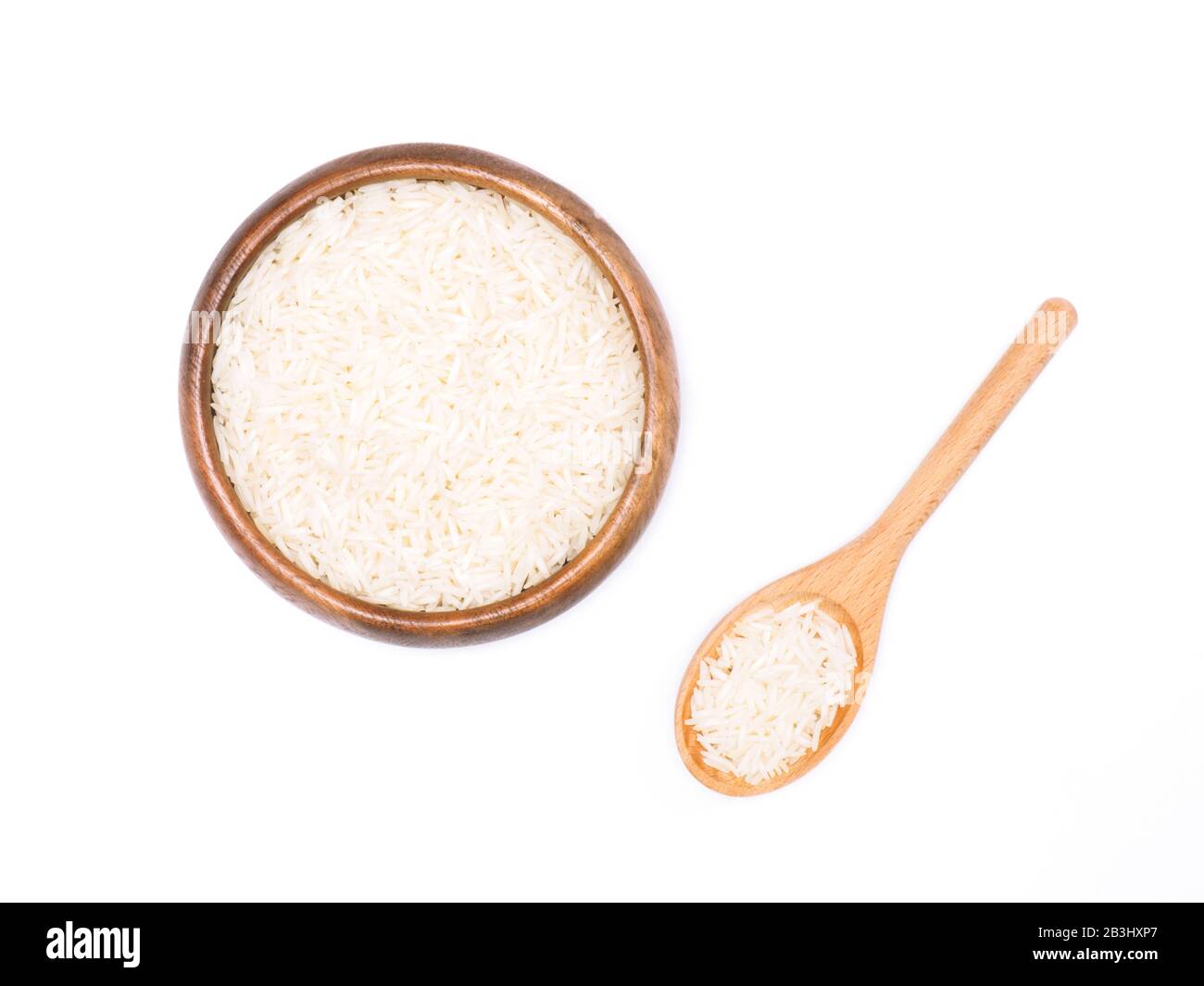 Indian long grain Basmati rice in brown wooden bowl and spoon isolated on white. Indian cuisine