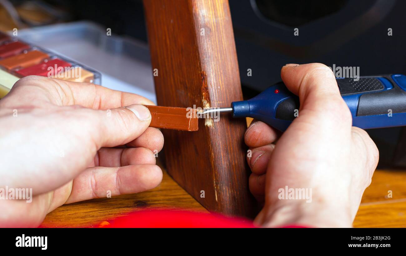 restoration repair wood surface on furniture sealing scratches and chips set of tools closeup