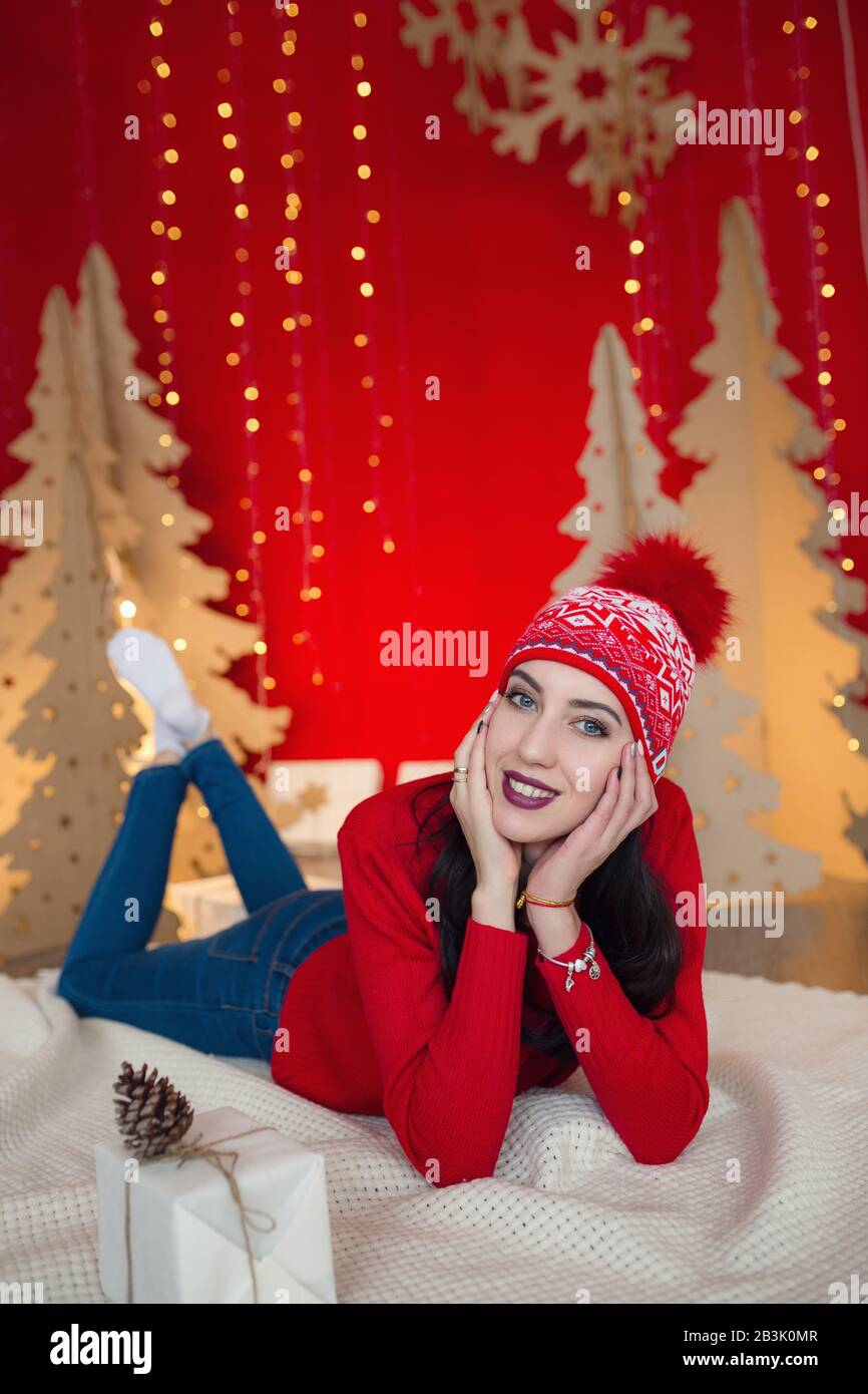 beautiful woman in warm clothing on christmas background. Very