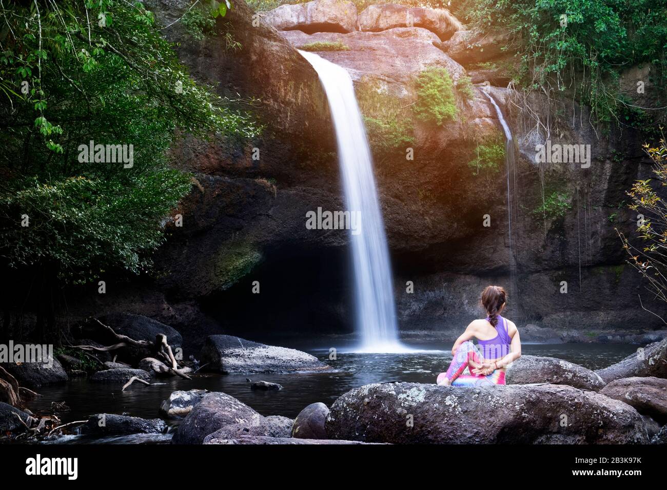 Woman yoga in front waterfall hi-res stock photography and images - Alamy