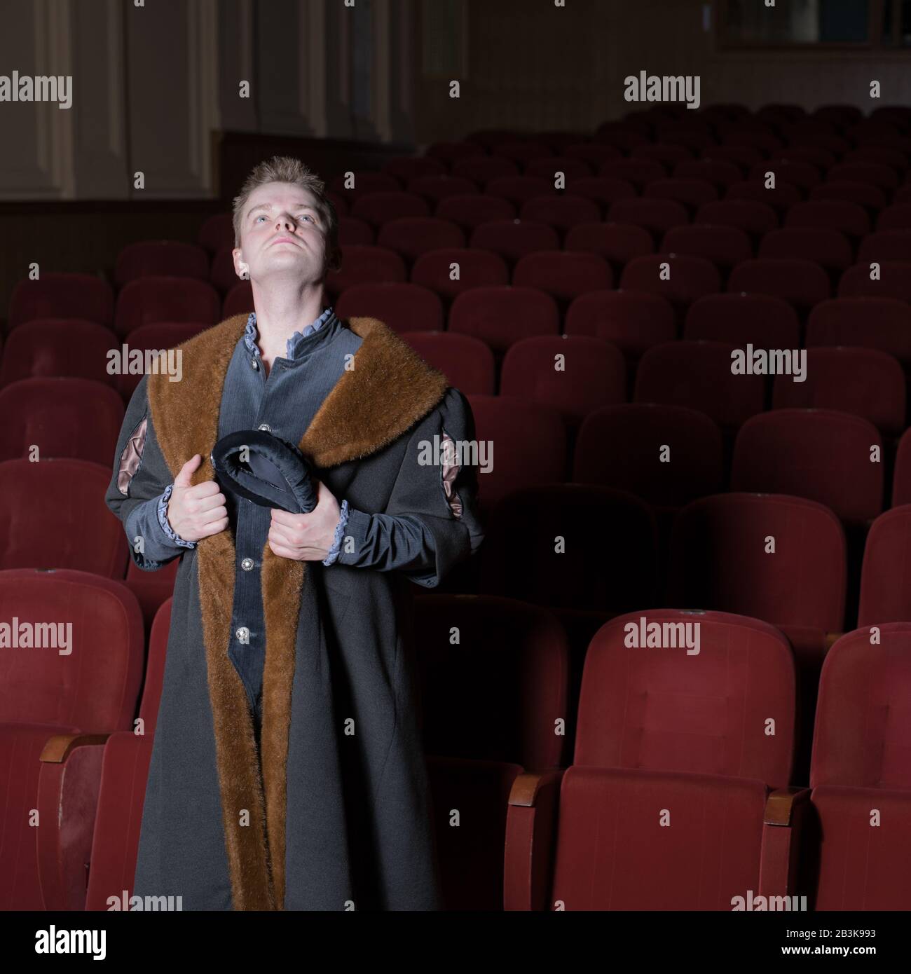 Actor dressed historical costume in interior of old theater Stock Photo ...