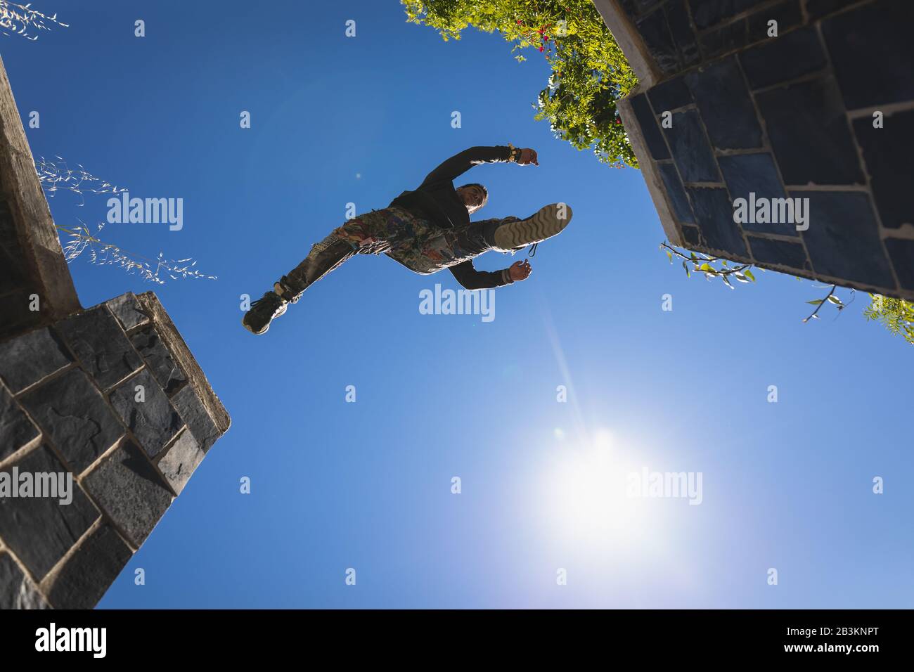 Caucasian man practicing parkour Stock Photo