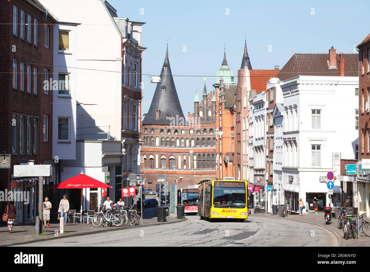 Buses on Holstenstrasse with Holsten Gate, Lübeck, Schleswig-Holstein, Germany, Europe Stock Photo
