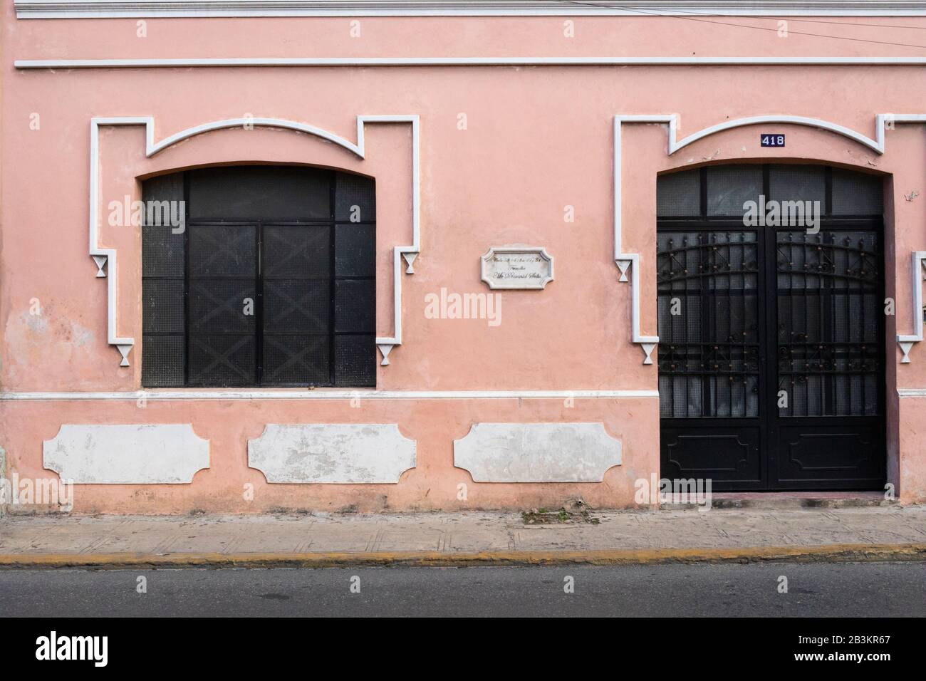 A pink and white minimalist art deco facade in Merida, Yucatan, Mexico. Stock Photo