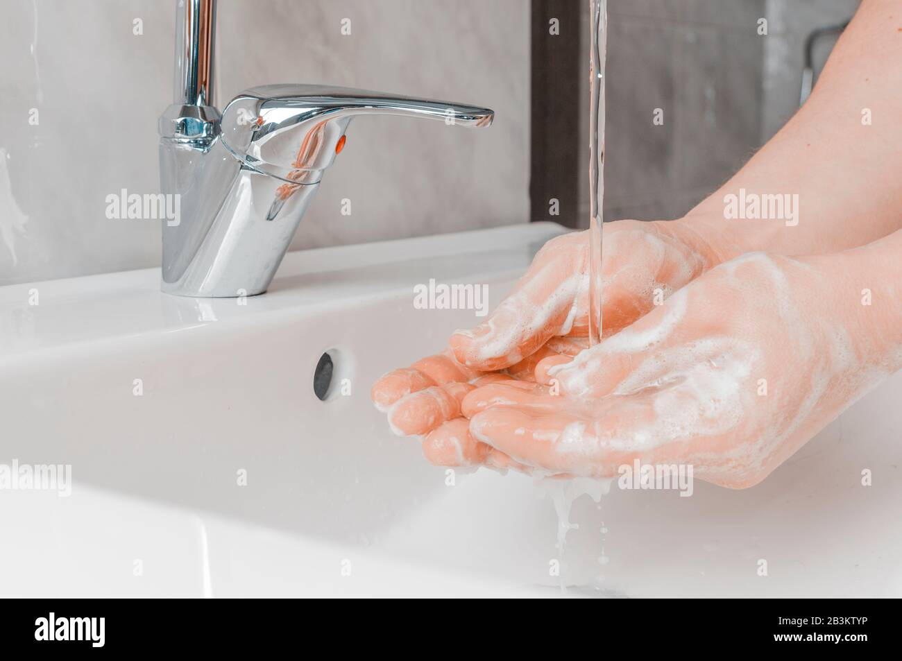 Effective handwashing techniques: rinse hand with water. Hand washing is very important to avoid the risk of contagion from coronavirus and bacteria. Stock Photo