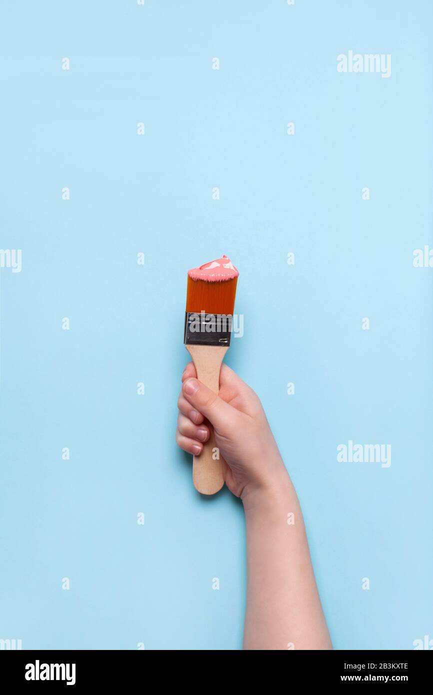 Boy hold paint brush hi-res stock photography and images - Alamy