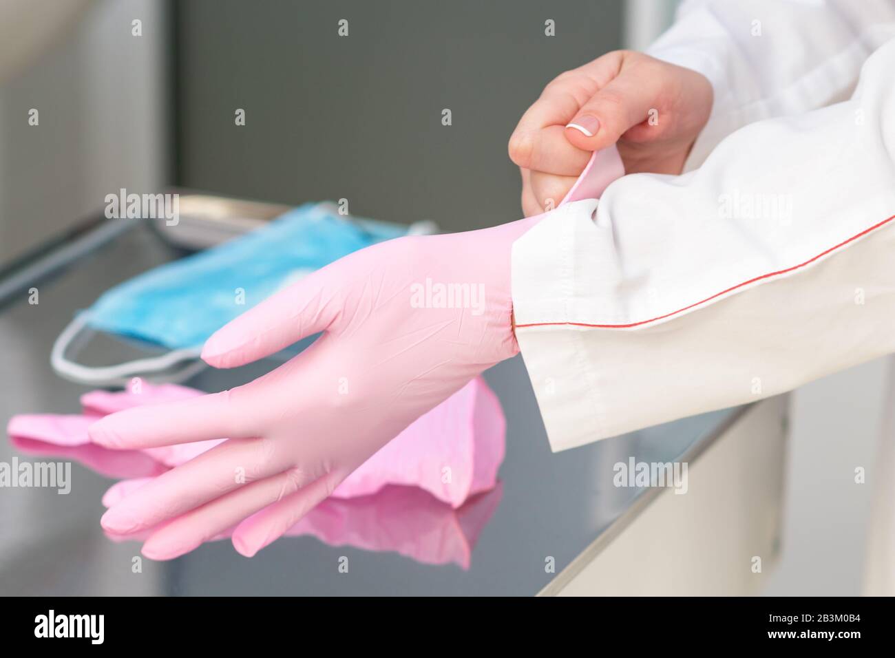 Pink latex gloves hi-res stock photography and images - Alamy