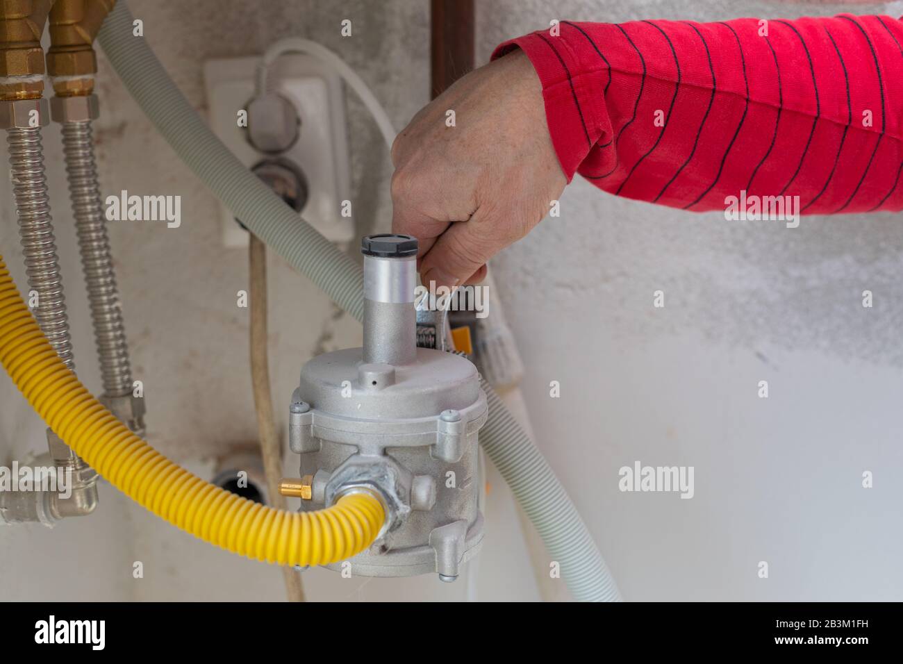 Plumbers hand repairing a gas pipe Stock Photo Alamy